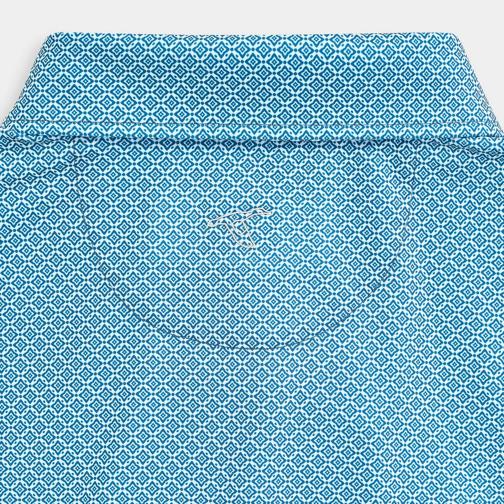 Polo performant bleu marine à motif losanges