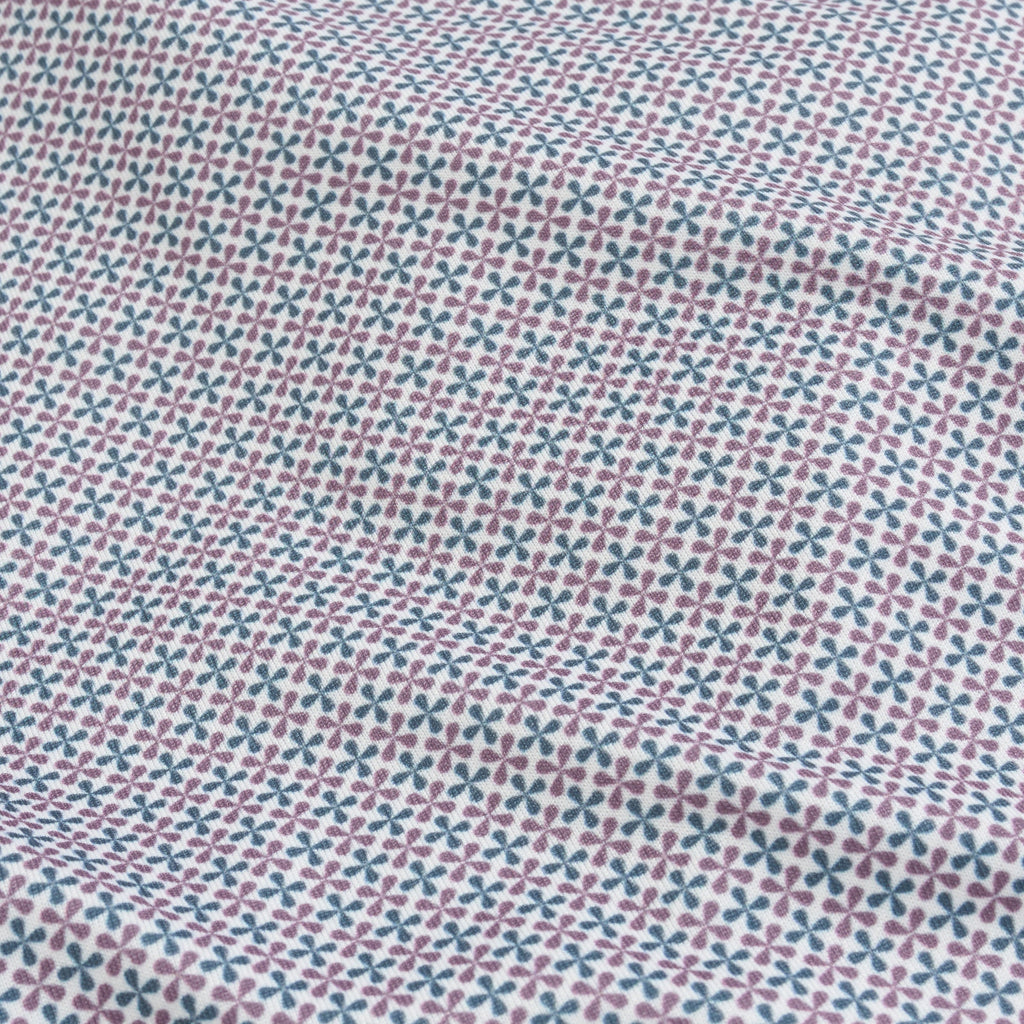 Polo de performance à imprimé géométrique