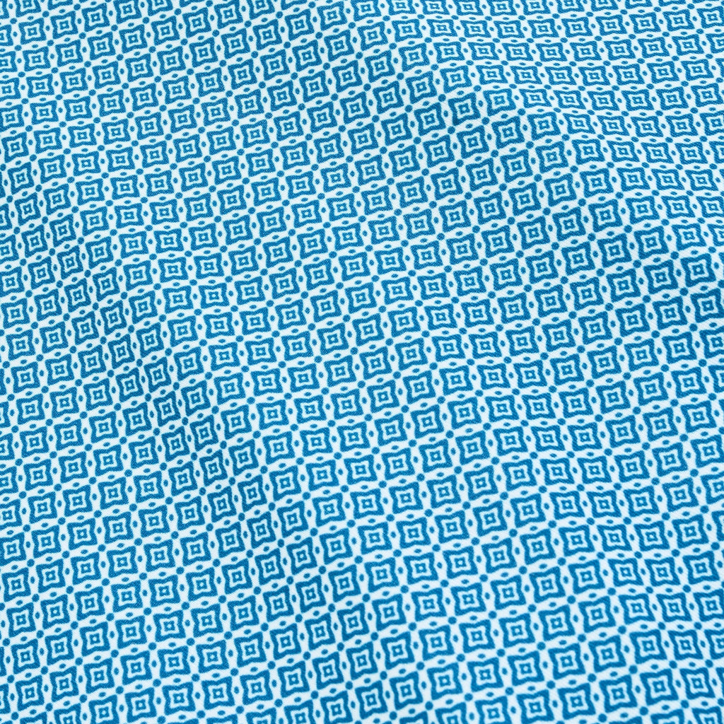 Polo performant bleu marine à motif losanges