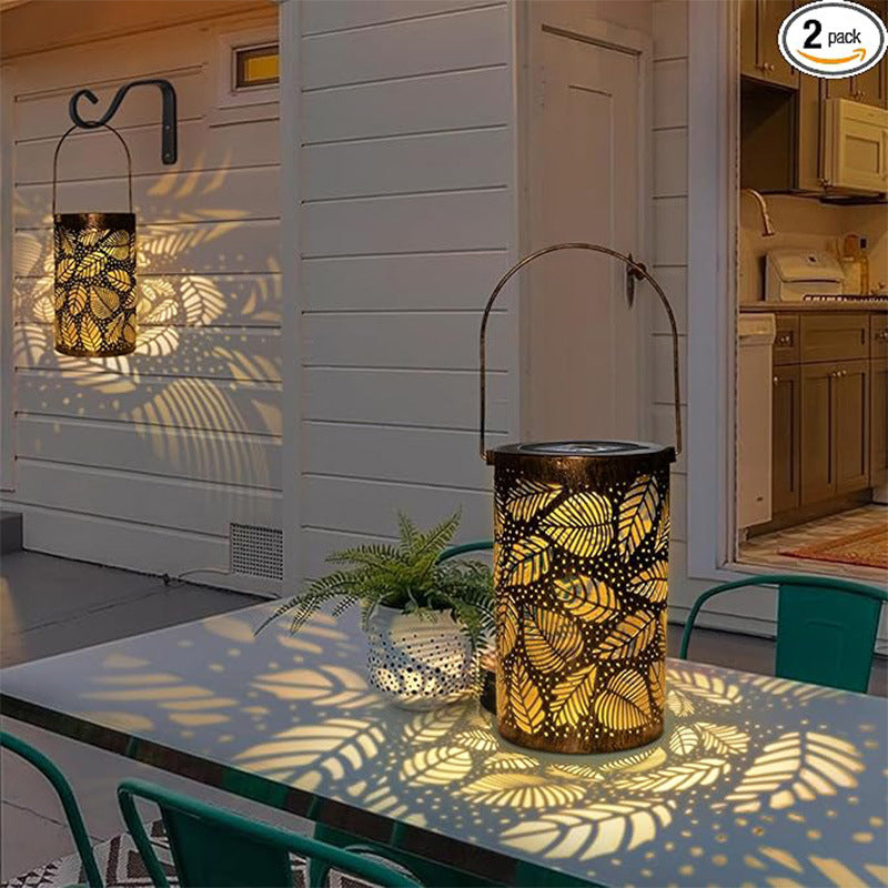 Lanterne solaire suspendue avec motifs ajourés